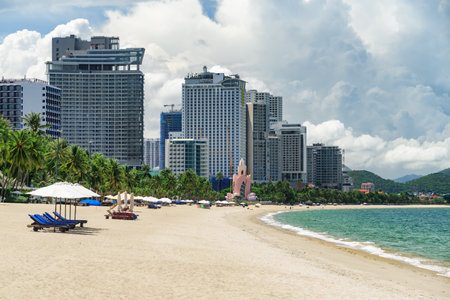 Awesome view of central beach of Nha Trang, Vietnam. Beautiful white sand tropical beach in coastal city. Scenic coastline. Amazing cityscape. Nha Trang is a popular tourist destination of Asia.の写真素材