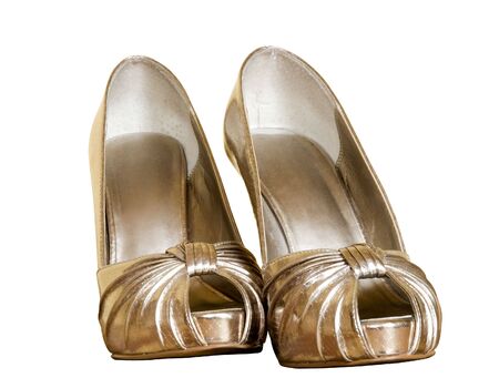 gold female shoes on whiteの写真素材