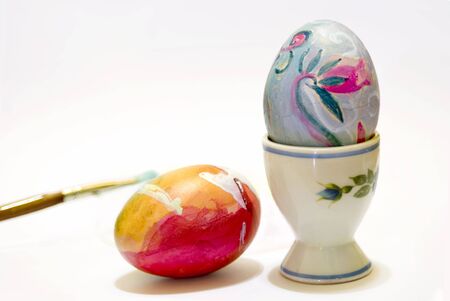 hands colored eggs