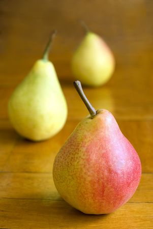 three pears on table
