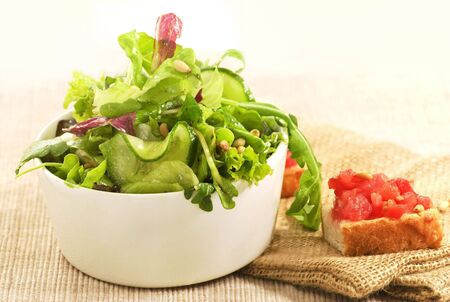 tomatoes toast and fresh mixed saladの写真素材