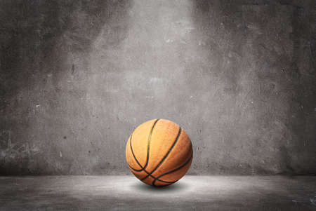 Basketball on a textured wall.の写真素材