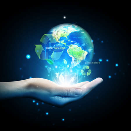 World globe on hand with energy saving conceptの写真素材