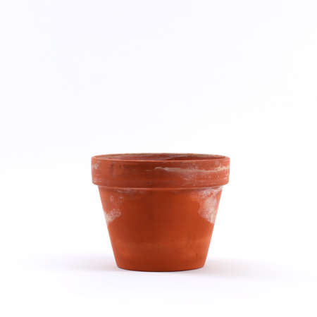 Dirty orange flower potの写真素材