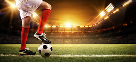 Football player at the stadium, the imaginary soccer stadium is modelled and rendered.の写真素材