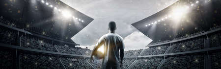 The football player in the stadium, the imaginary soccer stadium is modeled and rendered.の写真素材