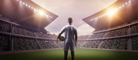 The football player in the stadium, the imaginary soccer stadium is modeled and rendered.の写真素材