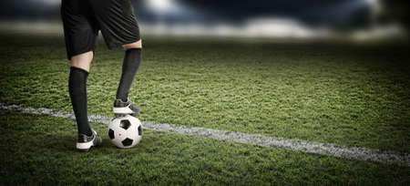 Football player in the stadium, the imaginary soccer stadium is modeled and renderedの写真素材