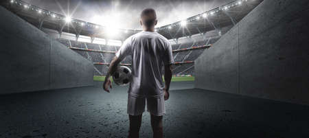 The football player in the stadium.The imaginary football stadium is modelled and rendered.の写真素材