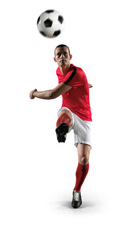 Soccer player in action on white background.Photo of soccer player in action on isolated background.の写真素材
