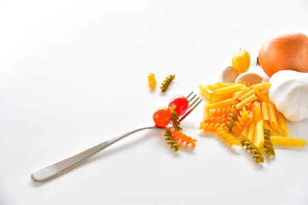 Food ingredients. Spaghetti, tomatoes, garlic, onion