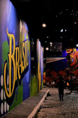 Street art in Sao Paulo and a kid running by the side of it.