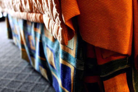 The bedskirt in the hotel room we stayed in on vacation, with the sunlight coming in through the...
