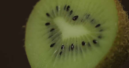 Kiwi piece on a dark background.の写真素材