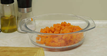 Sliced carrot pieces lay in the plate.の写真素材