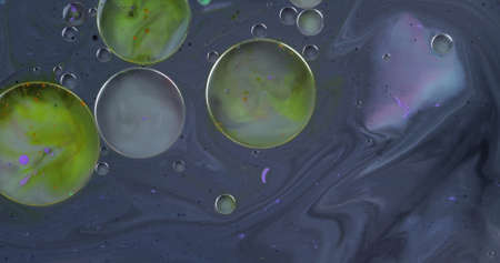Fantastic structure of colorful bubbles. Abstract colorful paint. Top view. Bubbles in the liquid...