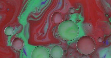 Fantastic structure with colorful bubbles. Abstract colorful paint. Top view. Bubbles in the liquid with milk, soap and paints. Oil surface multicolored background. Macroの写真素材