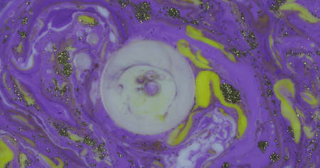 Abstract psychedelic background. Ink in a multicolored liquid. Colorful paint drops mixing in water....