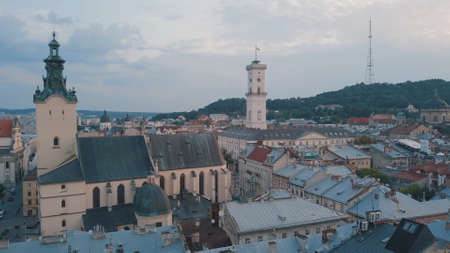 Aerial roofs and streets Old City Lviv, Ukraine. Central part of old european city in morning....
