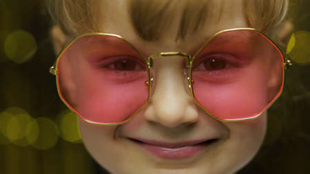 Close up face footage of child. Smiling, looking at camera. Little fun blonde kid teen teenager girl...