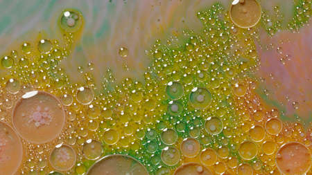 Colorful, gorgeous, vibrant theme or background, cosmetic effect. Bubbles float in liquid paint....