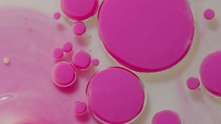 Top view fantastic structure of colorful oil paint and ink bubbles. Chaotic motion. Abstract colorful paint. Movement in liquid. Water surface multicolored texture background. Macro. Pattern, designの写真素材