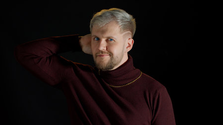 Handsome man in stylish blouse looking at camera through hands, posing, feeling happiness, fun,...