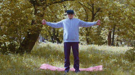 Modern old man exercising making dumbbell weight lifting exercises, practicing sport training in...