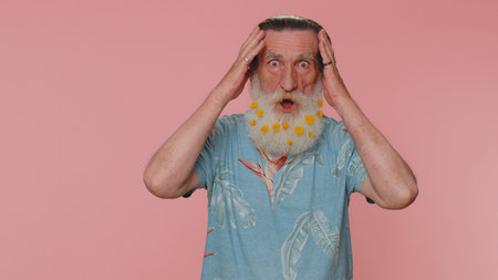 Oh my God, Wow. Excited amazed winner elderly man 60s raising hands in surprise looking at camera...