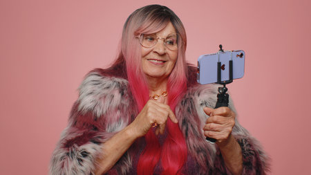 Tourist woman traveler blogger taking selfie on smartphone selfie stick communicating video call...