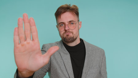 No stop, enought. Business man say No, hold palm folded crossed hands in stop danger gesture,...