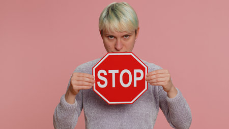 Serious woman say No, hold inscription text banner red No stop danger sign, warning of finish,...
