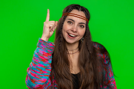 Eureka. Inspired young woman pointing finger up with open mouth, having good idea plan startup, showing inspiration motivation gesture, problem solution. Hippie girl isolated on chroma key backgroundの写真素材