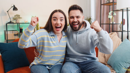 Young family married couple man woman shouting, celebrating success, winning, wow, goal achievement,...