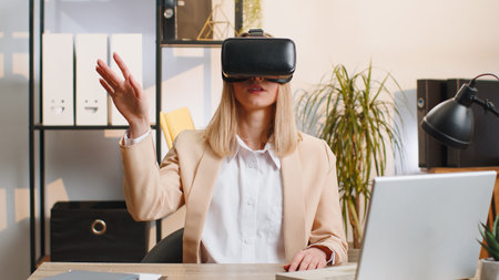 Business woman using virtual reality futuristic technology VR app headset helmet to simulation 3D...