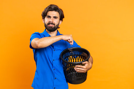 Attractive middle eastern man taking off throwing out glasses into bin after medical vision laser...