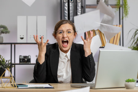 Stressed young business woman working looking at unpaid bank debt bills, doing paperwork, planning...