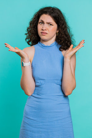 What Why. Sincere irritated young woman raising hands in indignant expression, ask reason of failure...