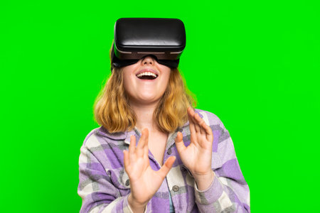 Excited happy adult woman using headset helmet app to play simulation game. Watching virtual reality...