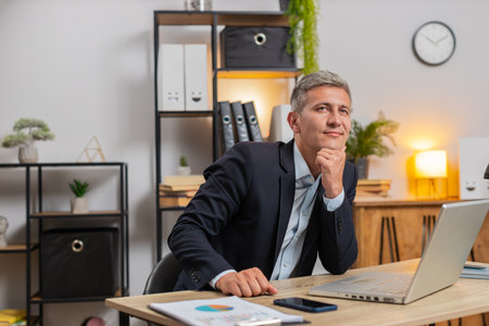 Young businessman entrepreneur prepares startup project for presentation finds idea. Employee...