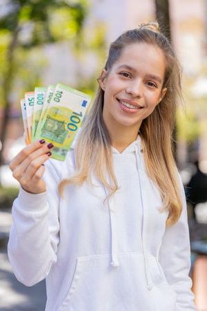 Portrait of successful rich Caucasian girl gambler gambling addiction business woman winner wins...
