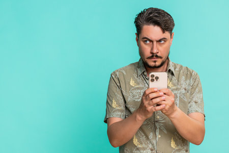 Middle-aged man anxiously types fast on smartphone, breathing deeply while focused on composing...