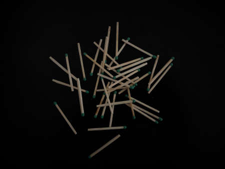 matches scattered on a black table.の写真素材