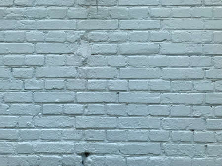 background brick wall painted in light blue.の写真素材