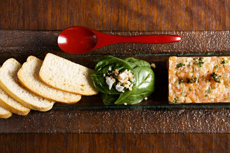 Bread and pate, raw fish seviche for sandwiches, from above, on a table. Fish rillette, healthy snack, diet food.の写真素材
