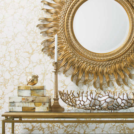 Golden luxury interiors with mirror and candles on a table. Bathroom mirror.の写真素材