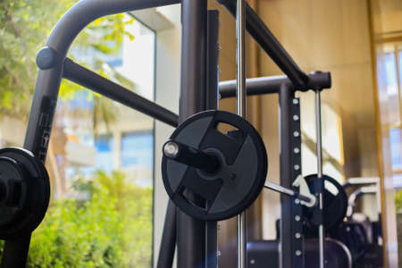 Free weights in Gym, training machine in gymnasium, close up, side view. Chest press machine in gym.の写真素材