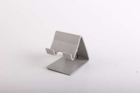 Plastic phone holder for wire chargeの写真素材