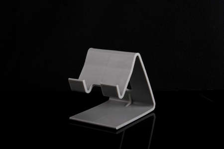 Plastic smart phone holder for charge side viewの写真素材