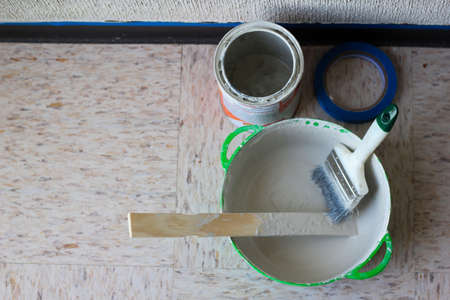 Set of wall painting elements paint bucket, paintbrush and blue masking tapeの写真素材